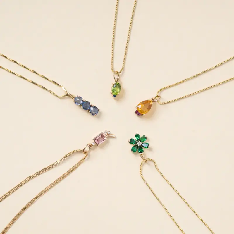 Gold chain necklaces with peridot, tanzanite, pink and green gemstone pendants