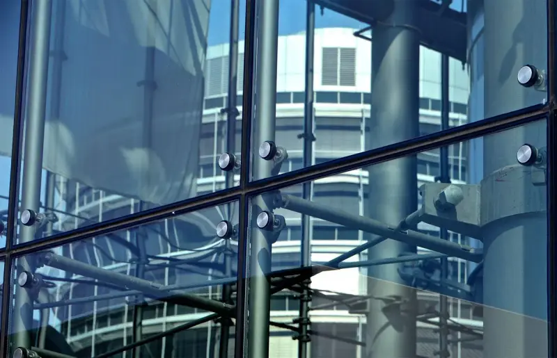 Point-supported structural glass panels held by stainless spider fittings