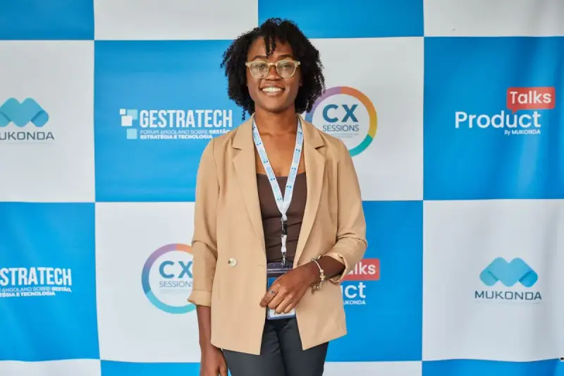 Professional event attendee in front of a technology and product-talks backdrop