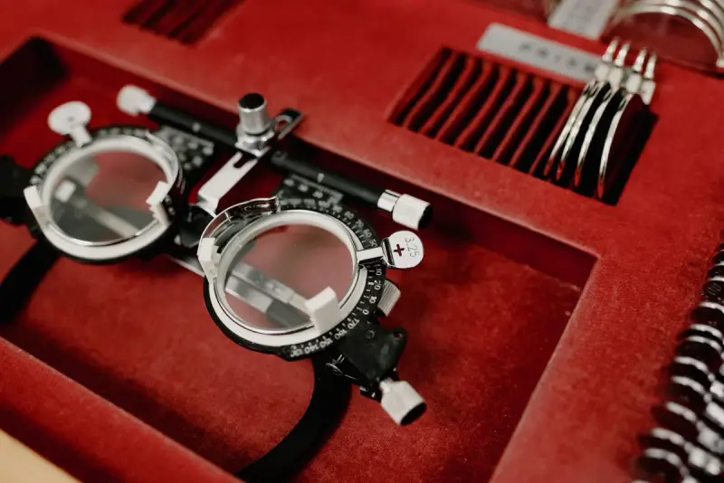 Optometry diagnostic tool set in an open red case