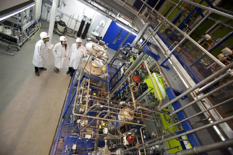 Pilot carbon capture plant with columns, piping and steel structure outdoors