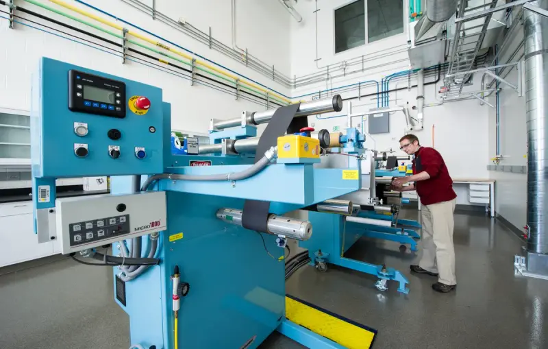 Researcher setting up equipment in a hydrogen materials laboratory