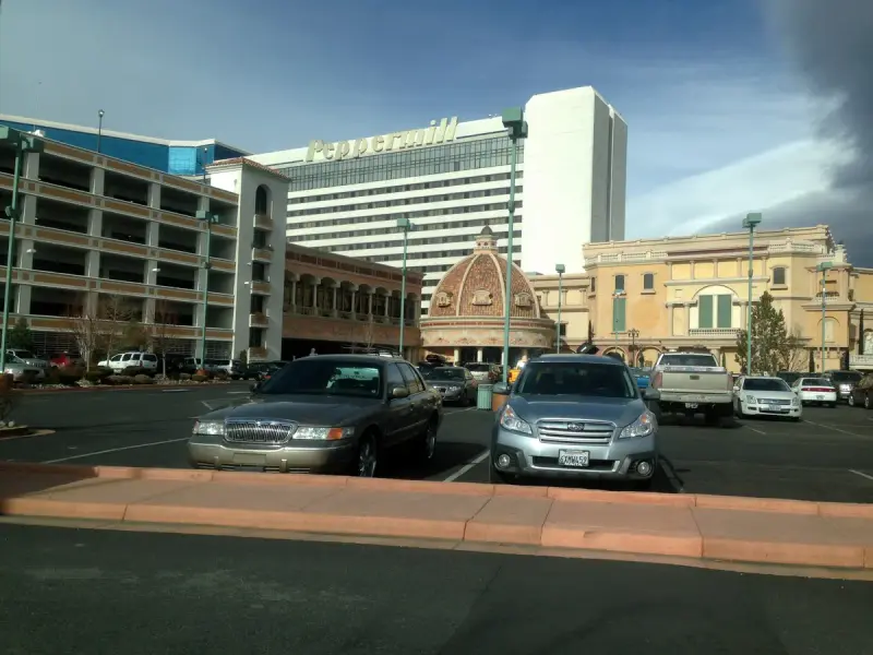 Hotel tower and domed entrance of the Peppermill Resort in Reno, Nevada, seen from the parking lot