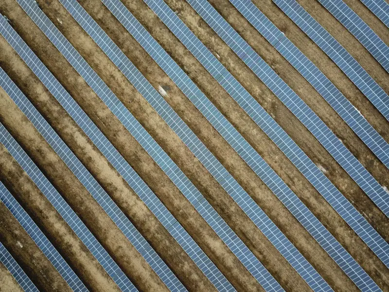 Drone view of solar panel rows at a solar farm in Watertown, Minnesota