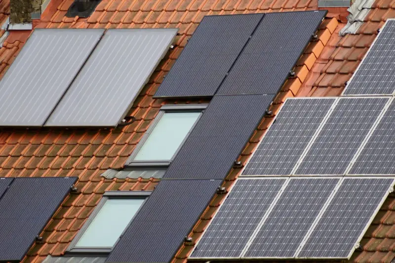Close-up of solar panels mounted on a tiled roof