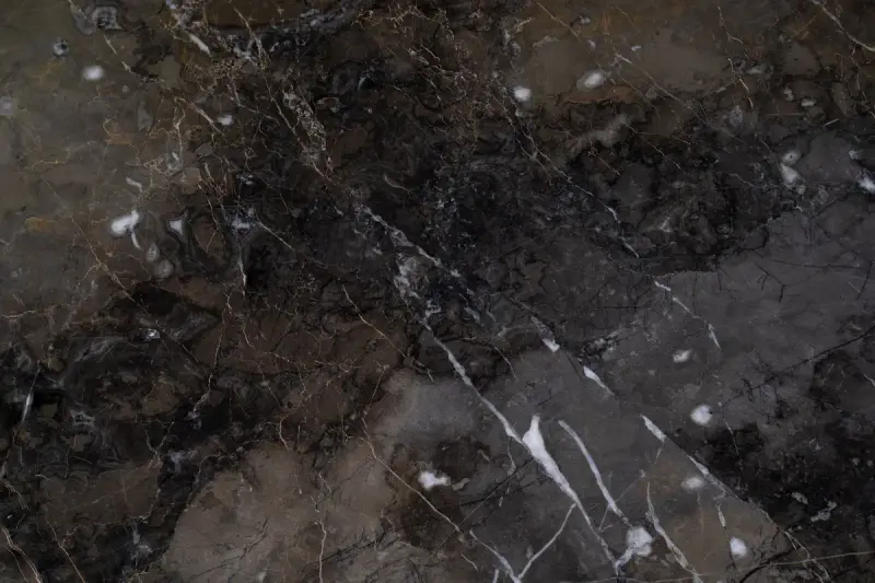 Dark brown marble surface with fine white veins