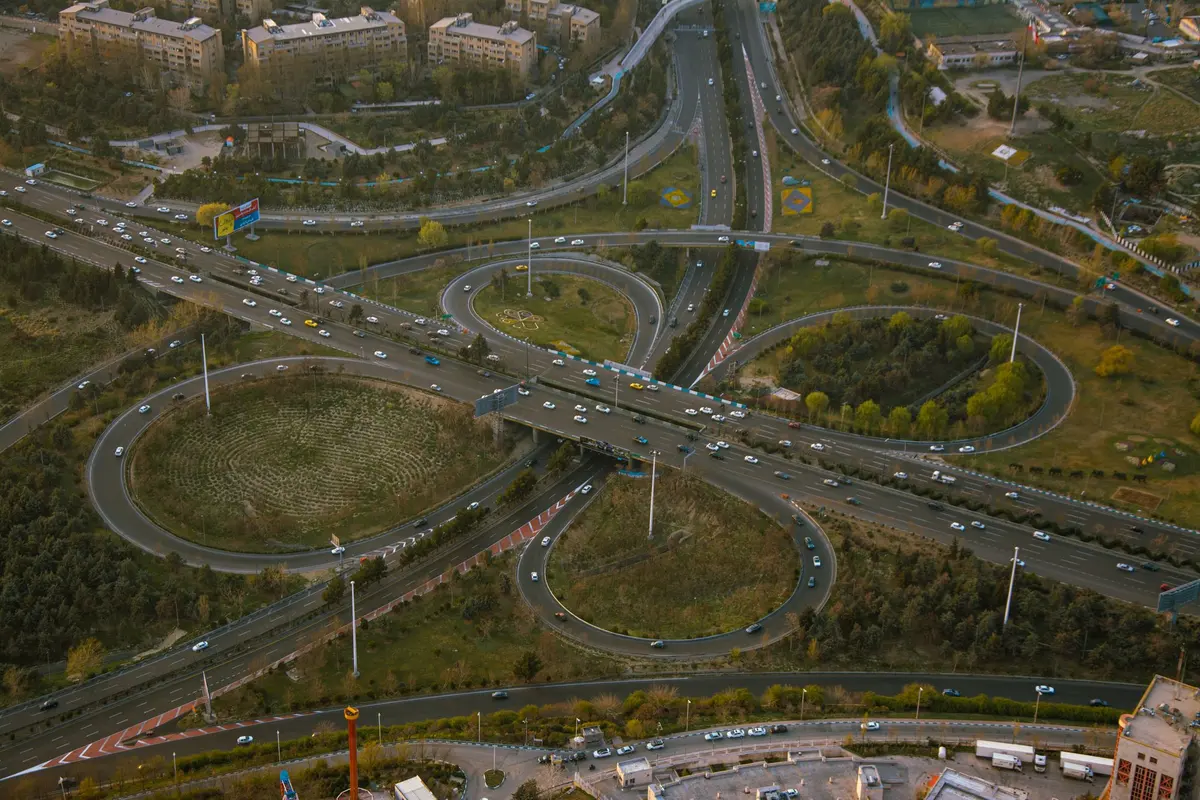 Aerial view of a multilevel highway interchange with traffic flowing in daylight
