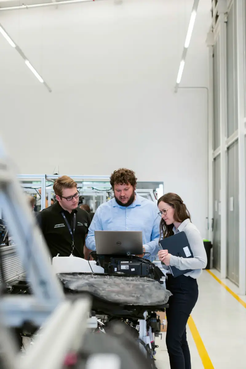 Team of engineers working together in an industrial facility