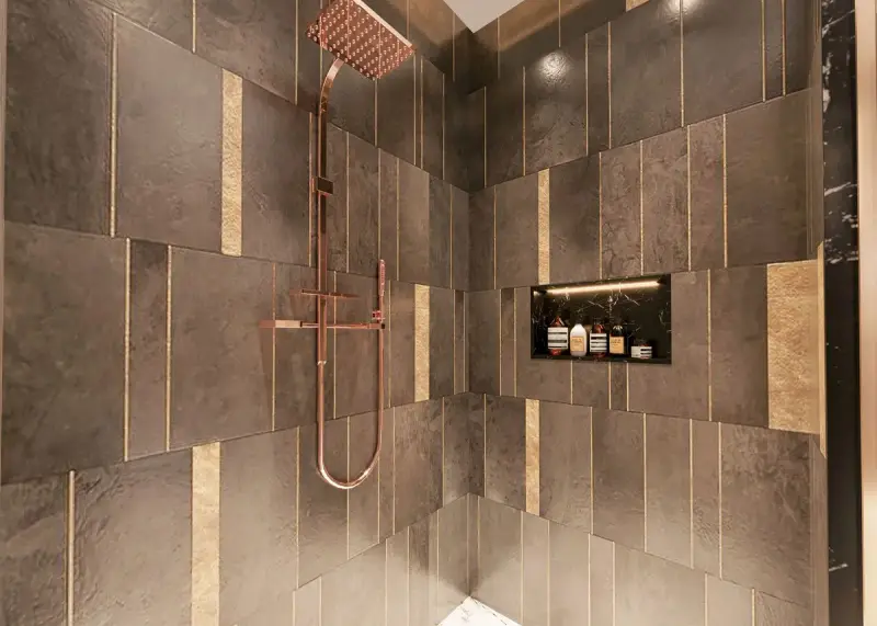 Shower with dark stone tiles, brass strips and copper rain shower fixtures
