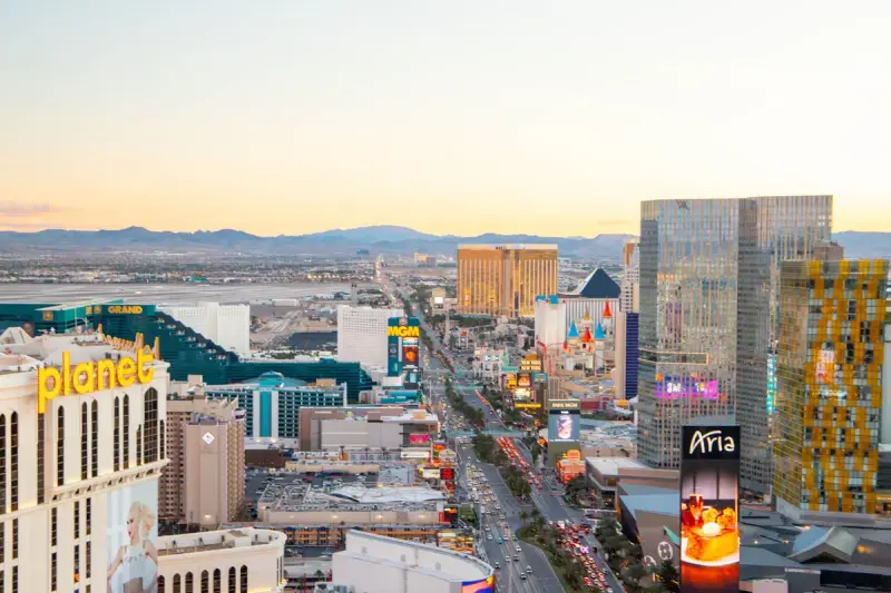 Aerial view of the Las Vegas Strip skyline at sunset with resort towers