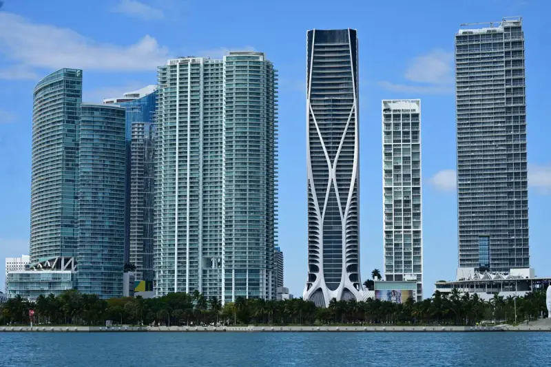 Miami's waterfront skyline of modern towers under a blue sky
