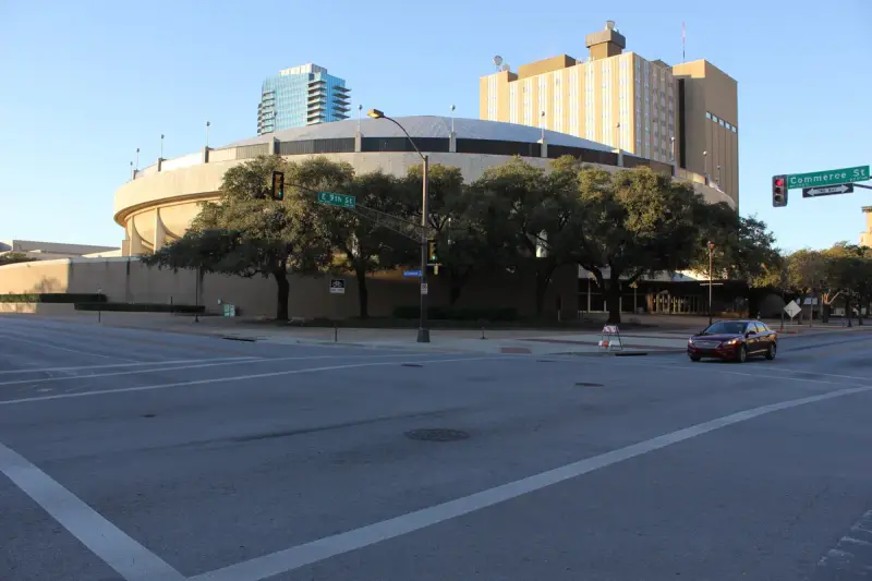 Round arena wing of the Fort Worth Convention Center seen across Commerce Street and East 9th Street