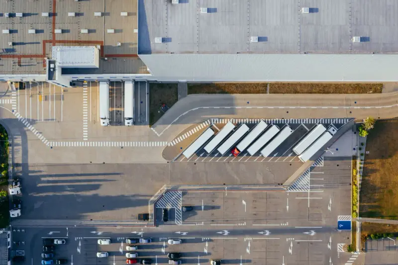 Aerial view of a logistics center with trailers backed into the loading docks