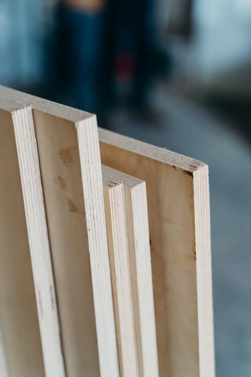 Plywood panels standing on edge showing their layered veneer edges