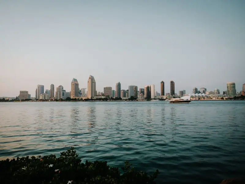 San Diego towers across calm water in soft evening light