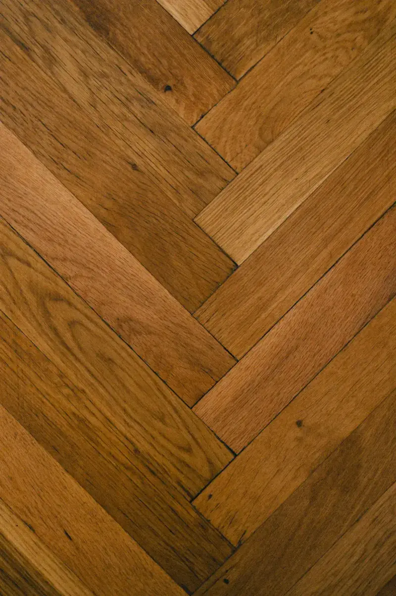 Close-up of a wooden herringbone parquet pattern