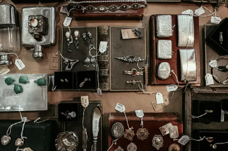 Vintage and antique items, jewelry and decorative pieces arranged on a display