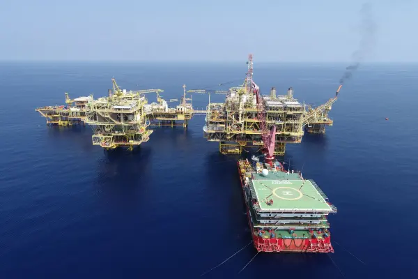 Aerial view of offshore platforms surrounded by blue water in Malaysia