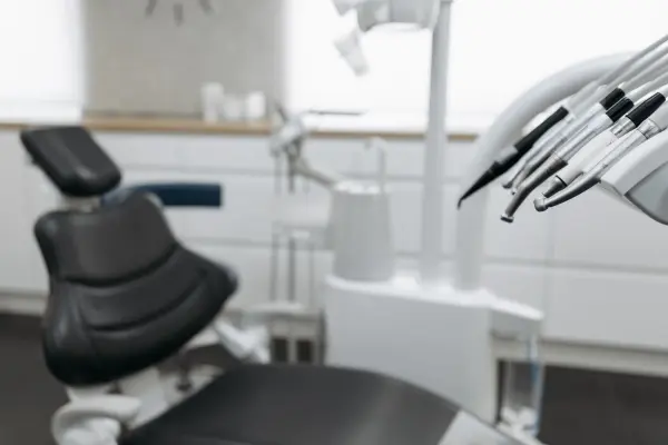 Dental handpieces with a treatment chair in the background