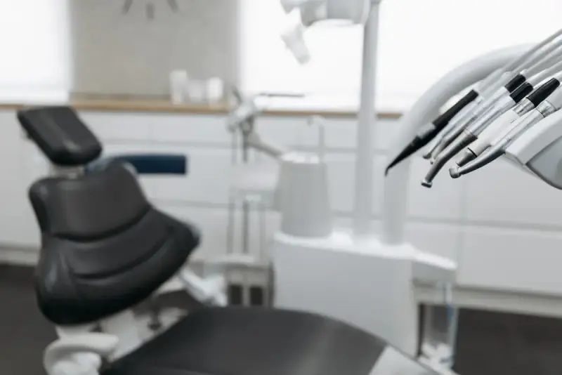 Dental handpieces with a treatment chair in the background