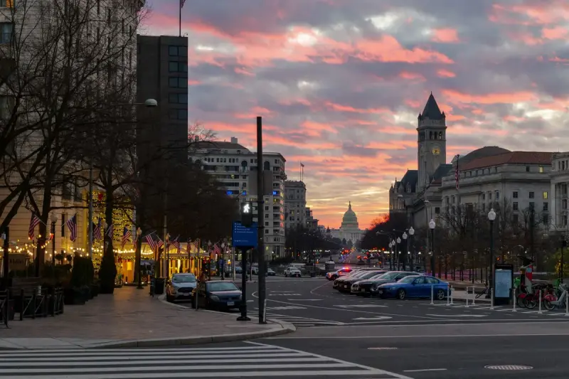 Pennsylvania Avenue in Washington at sunset with the Capitol dome in the distance