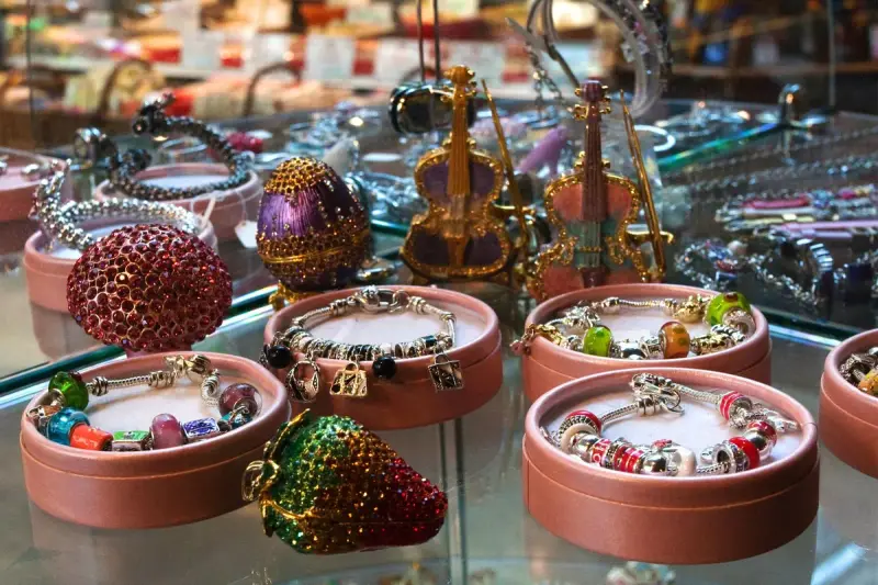 Bracelets and small decorative pieces arranged in a retail shop display