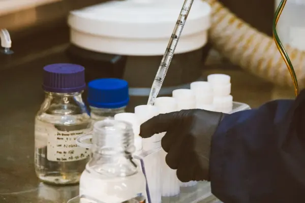 Close view of laboratory equipment and pipette use