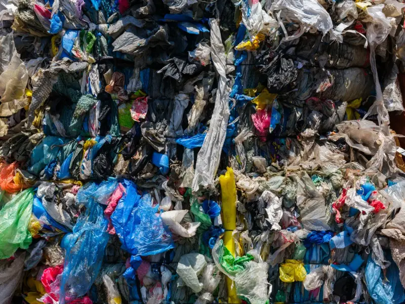Compacted bale of mixed plastic film and bags ready for recycling