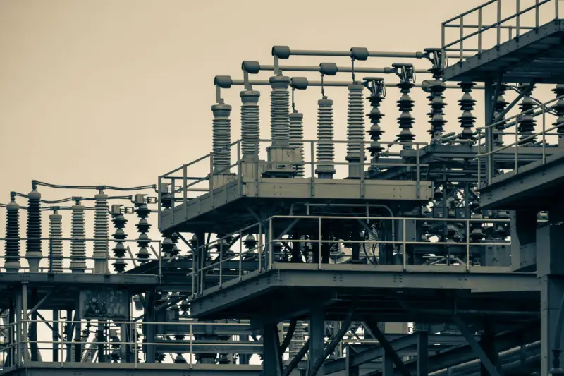 Steel framework, insulators and conductors of an urban power station switchyard