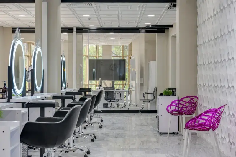 Chic salon space with sleek styling chairs, mirrors and modern decor