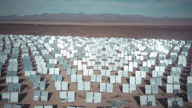 Expansive field of solar panels in a sunny desert