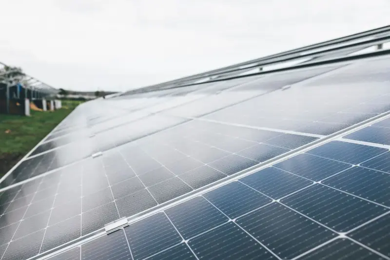 Close view of solar module rows at an outdoor solar farm