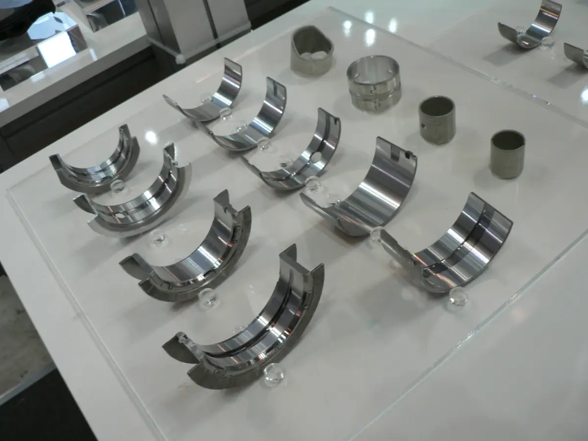 Crankshaft journal bearing display; automotive engineering reference.