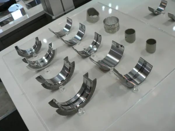 Crankshaft journal bearing display; automotive engineering reference.