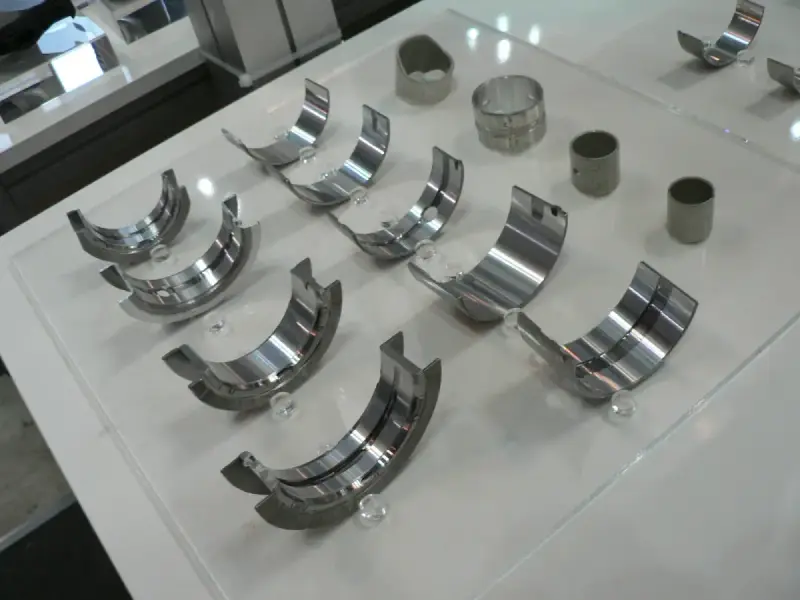 Crankshaft journal bearing display; automotive engineering reference.