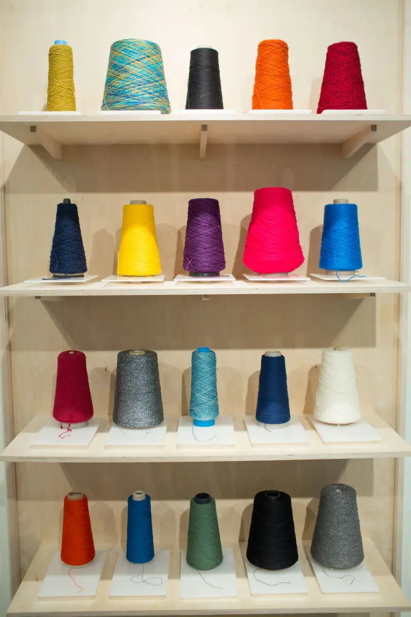 Yarn bobbins feeding a knitting machine