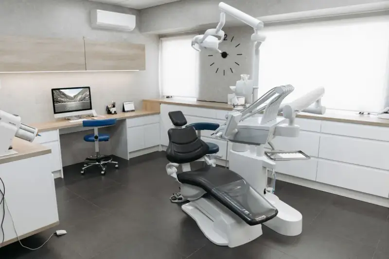 Modern dental clinic with a chair, monitor and equipment
