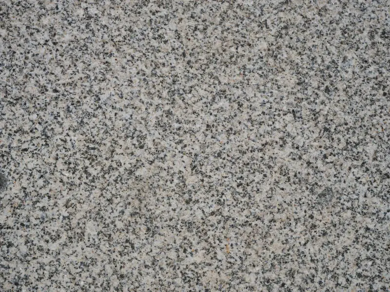 Gray salt-and-pepper granite surface filling the frame