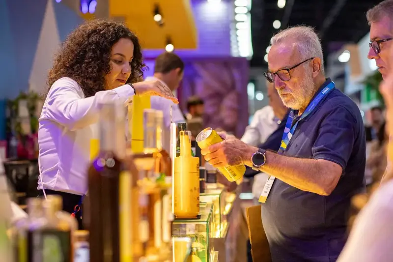 Visitors tasting products and speaking with exhibitors at Anuga Select Brazil 2025