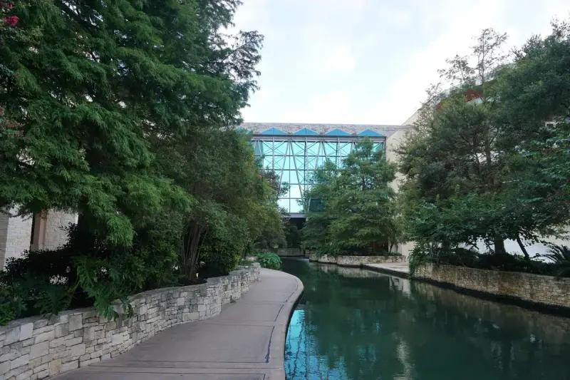 Glass atrium of the Henry B. González Convention Center above the River Walk canal