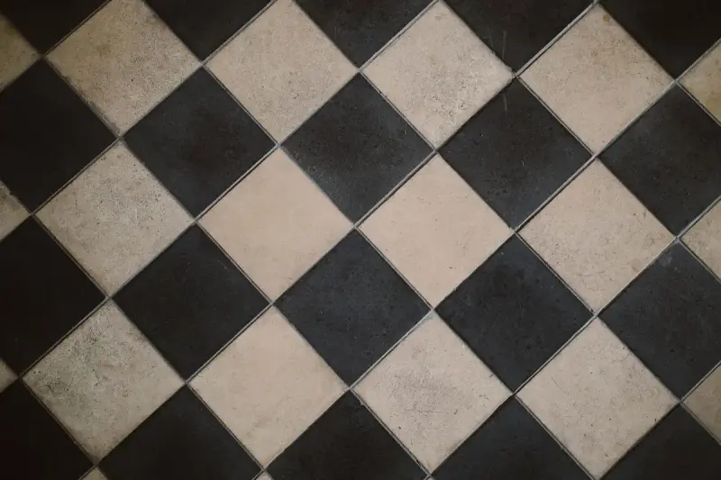 Black and white checkered floor tile laid on the diagonal