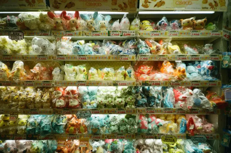 Store shelves stacked high with packaged plush toys in soft pastel colors