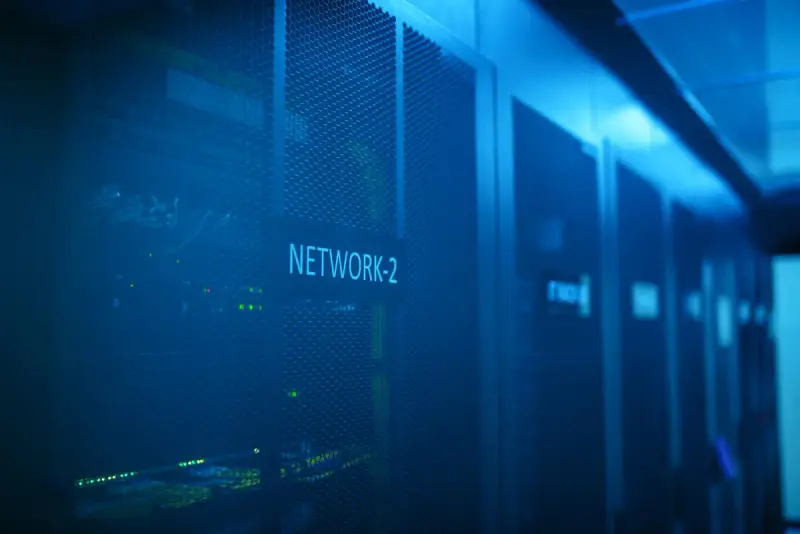 Server room with network equipment under blue lighting