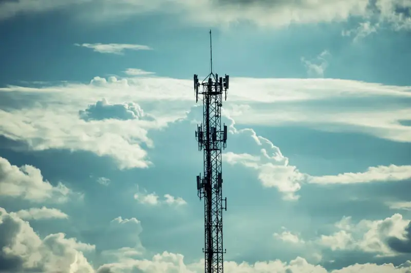Drone view of a radio tower under a cloudy sky