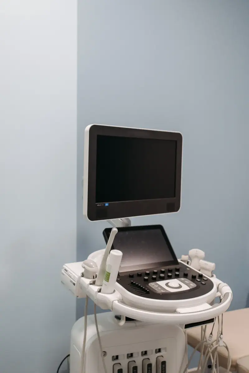 Digital ultrasound machine with its monitor on a wheeled cart