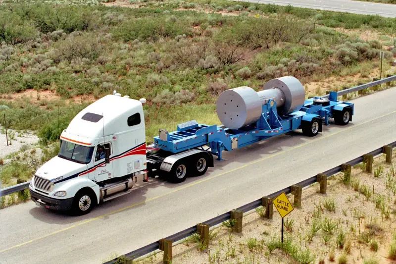 Truck carrying shielded radioactive waste containers on a highway