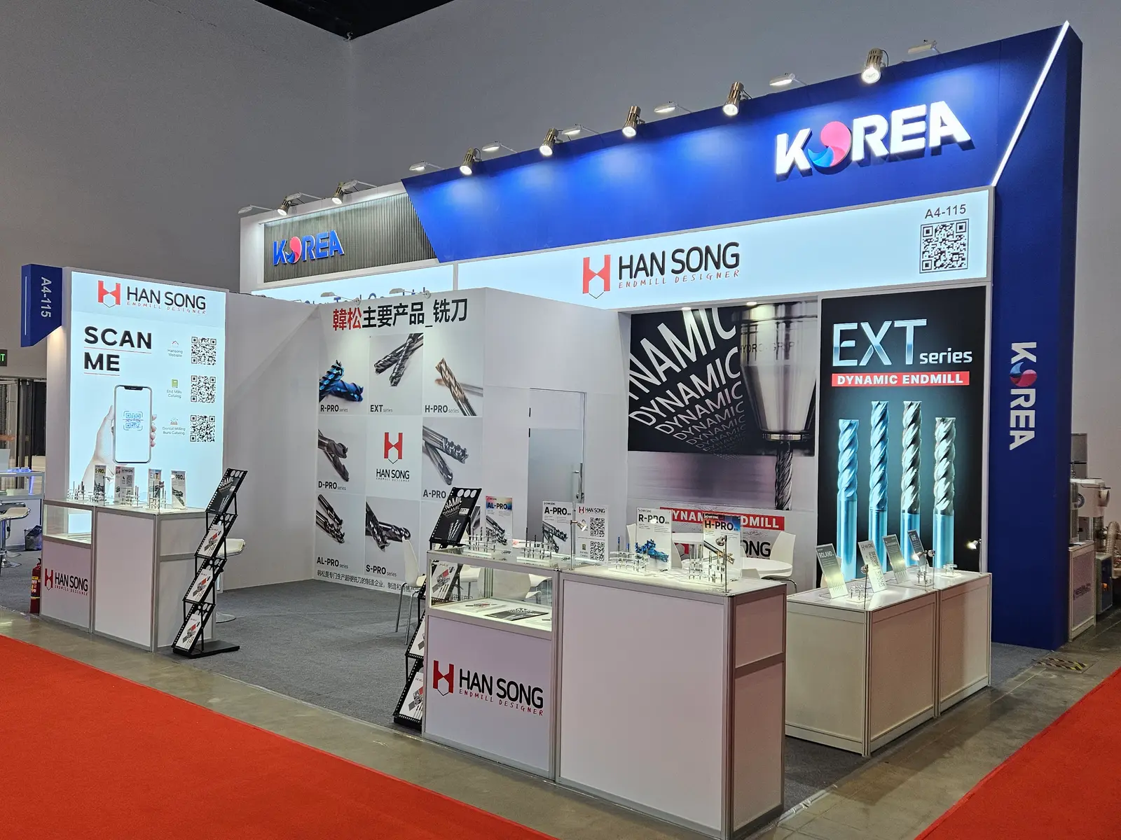 Han Song booth by Purple Exhibits: blue and white Han Song booth in a Korea pavilion with a lightbox showing end mills