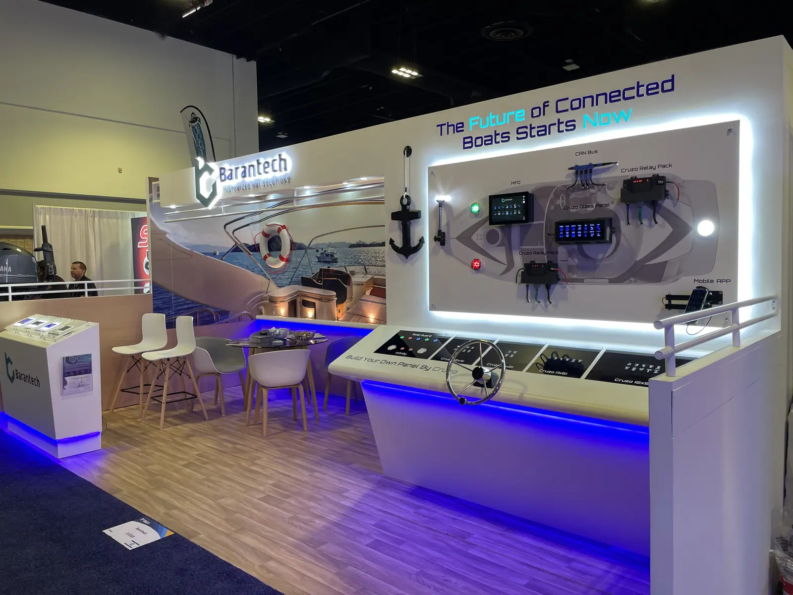 Barantech booth by Purple Exhibits: white inline booth for Barantech with blue LED edge lighting