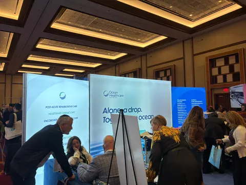Ocean Healthcare Network booth by Purple Exhibits: blue-and-white backlit fabric wall for Ocean Healthcare Network, a Purple build like the booths we plan for NCPA Annual Convention