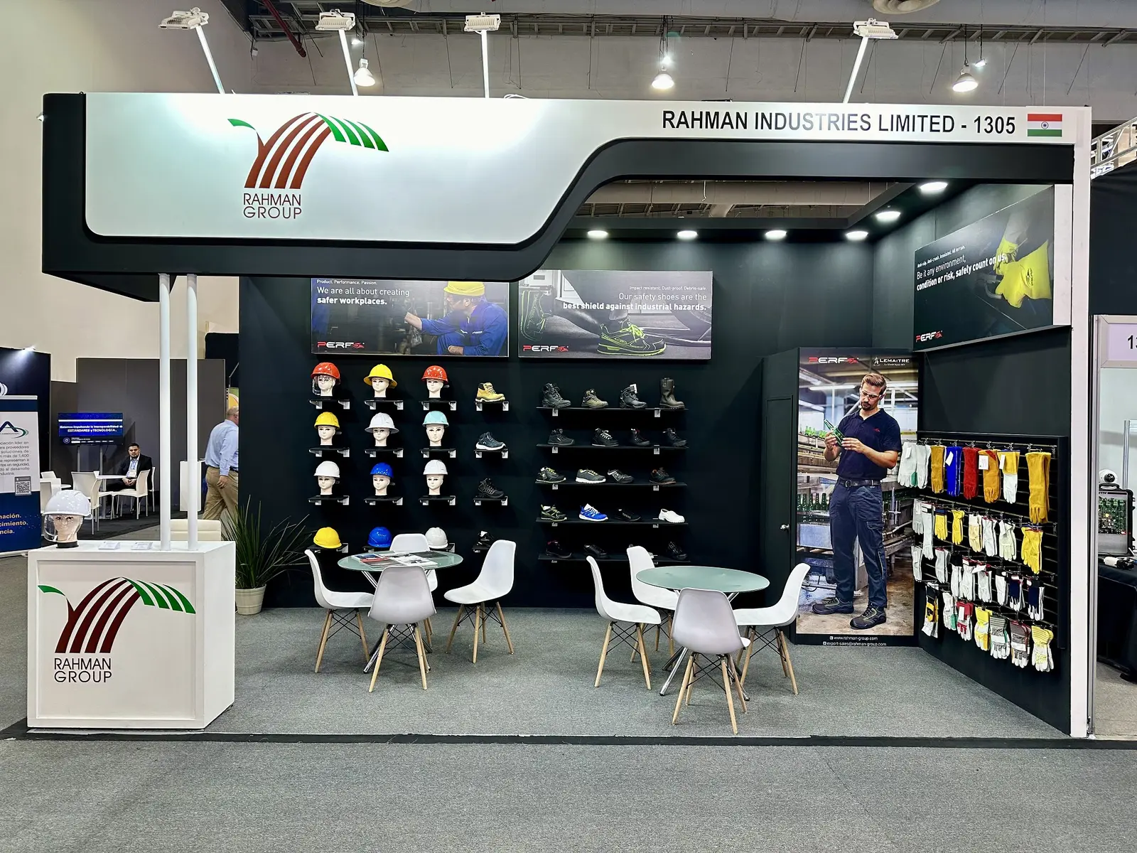 Rahman Industries Limited booth by Purple Exhibits: rahman Group inline booth with a white curved header, a Purple build like the booths we plan for IMTS
